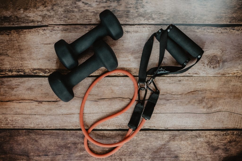 a pair of black headphones on a wooden surface