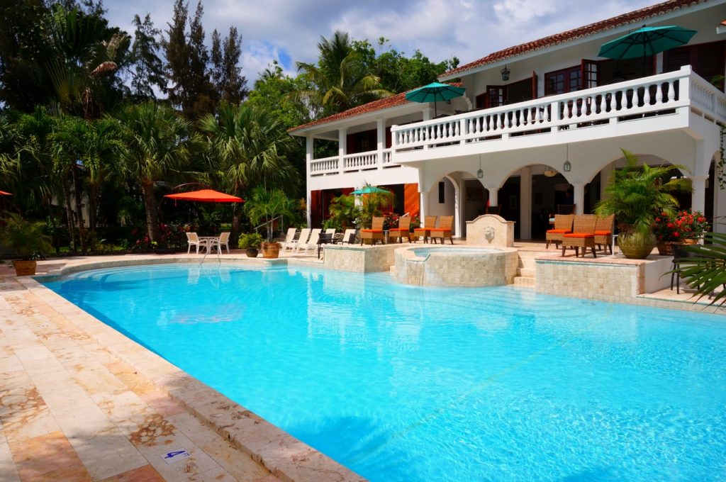 a swimming pool with a building in the background