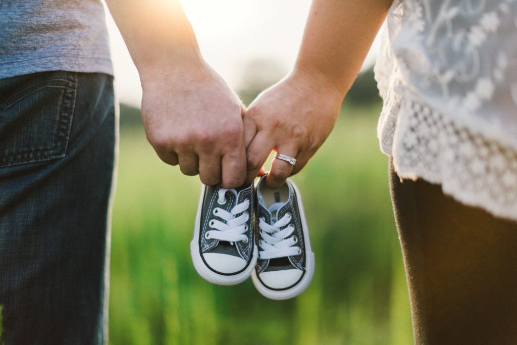 a man and woman holding hands