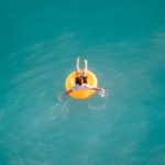 a person in a yellow floating device