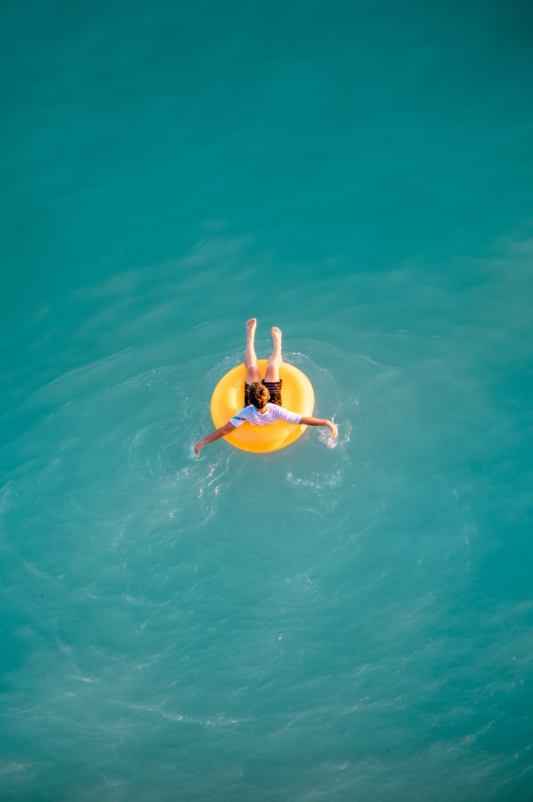 a person in a yellow floating device