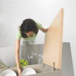 a girl standing in a bathtub