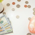 a close-up of a bag of money and coins