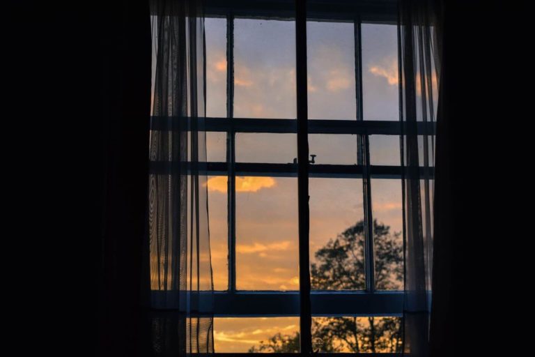 a window with a sunset