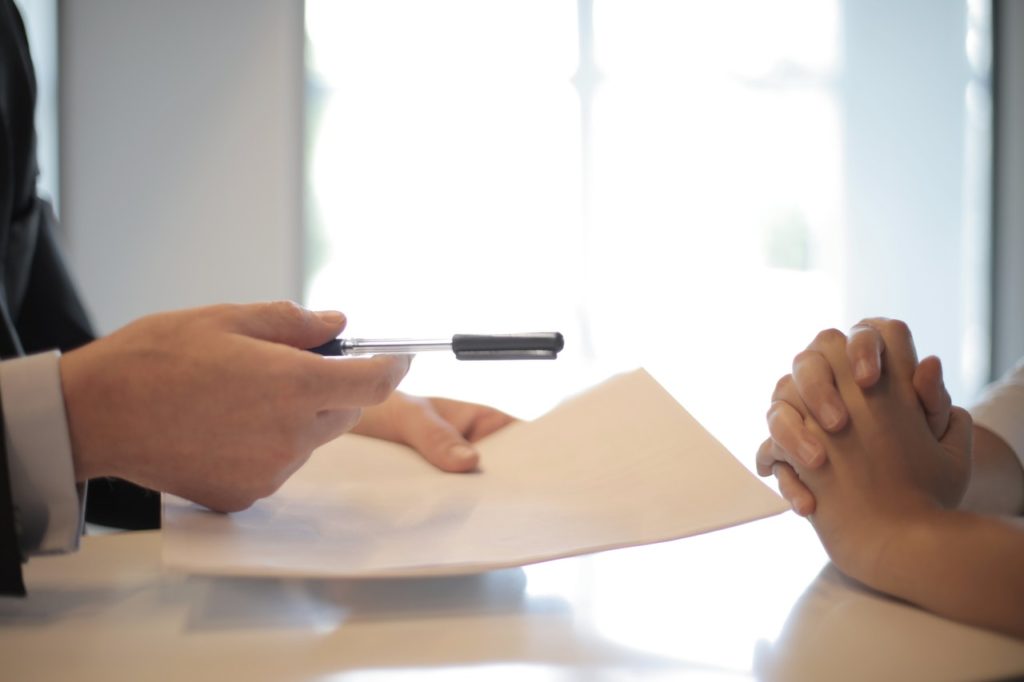 a person writing on a paper