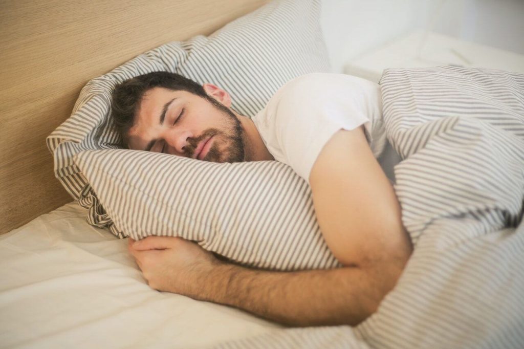 a person sleeping on a bed