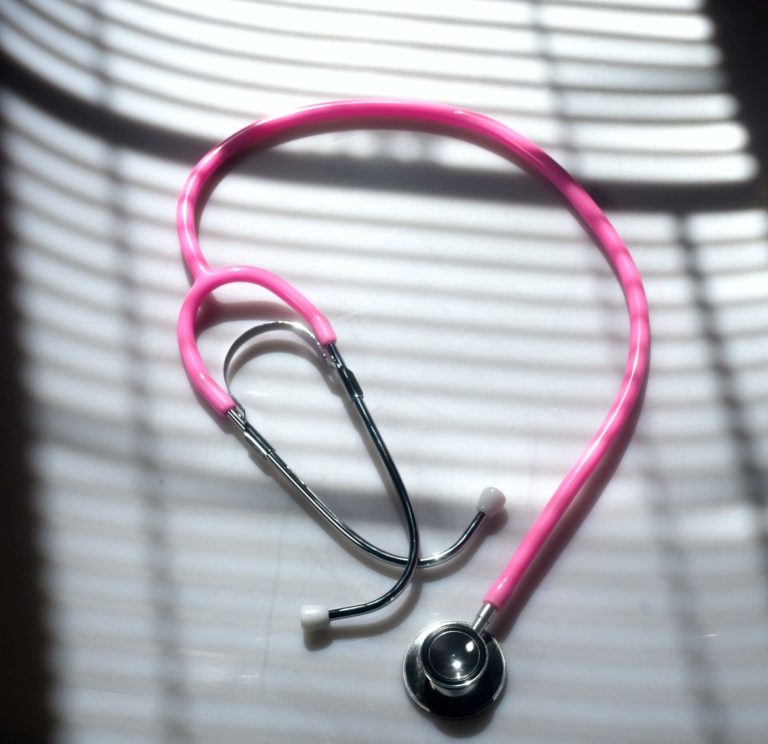 a pink wire on a black surface