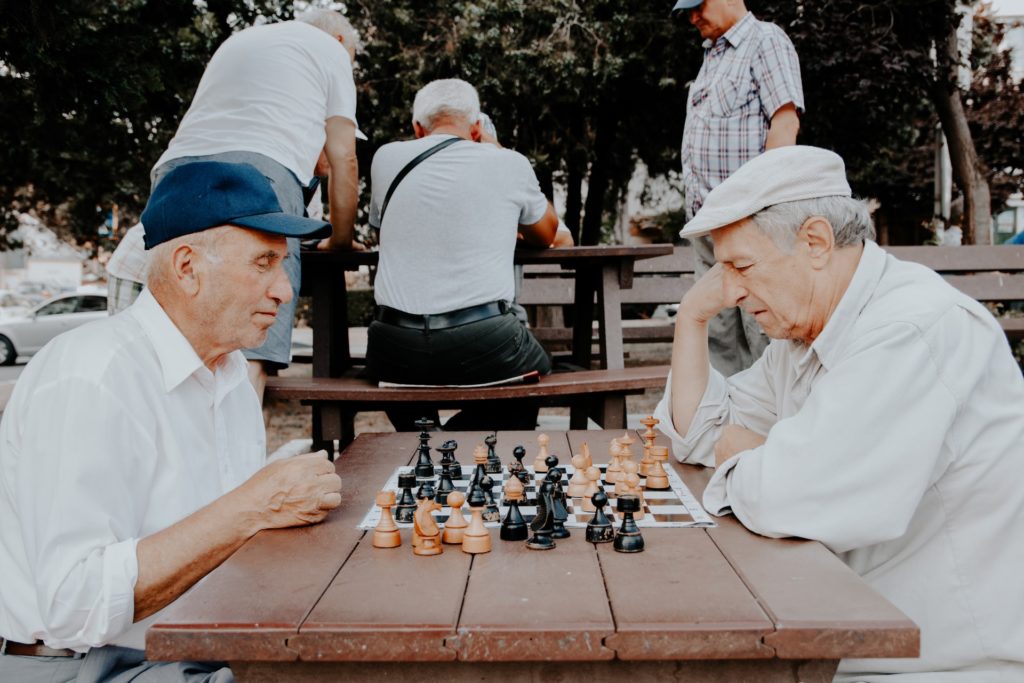 a group of men playing chess