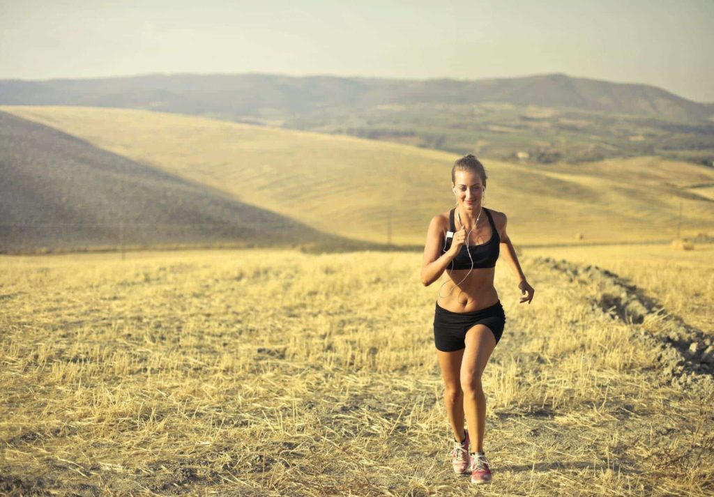 a woman running on a field